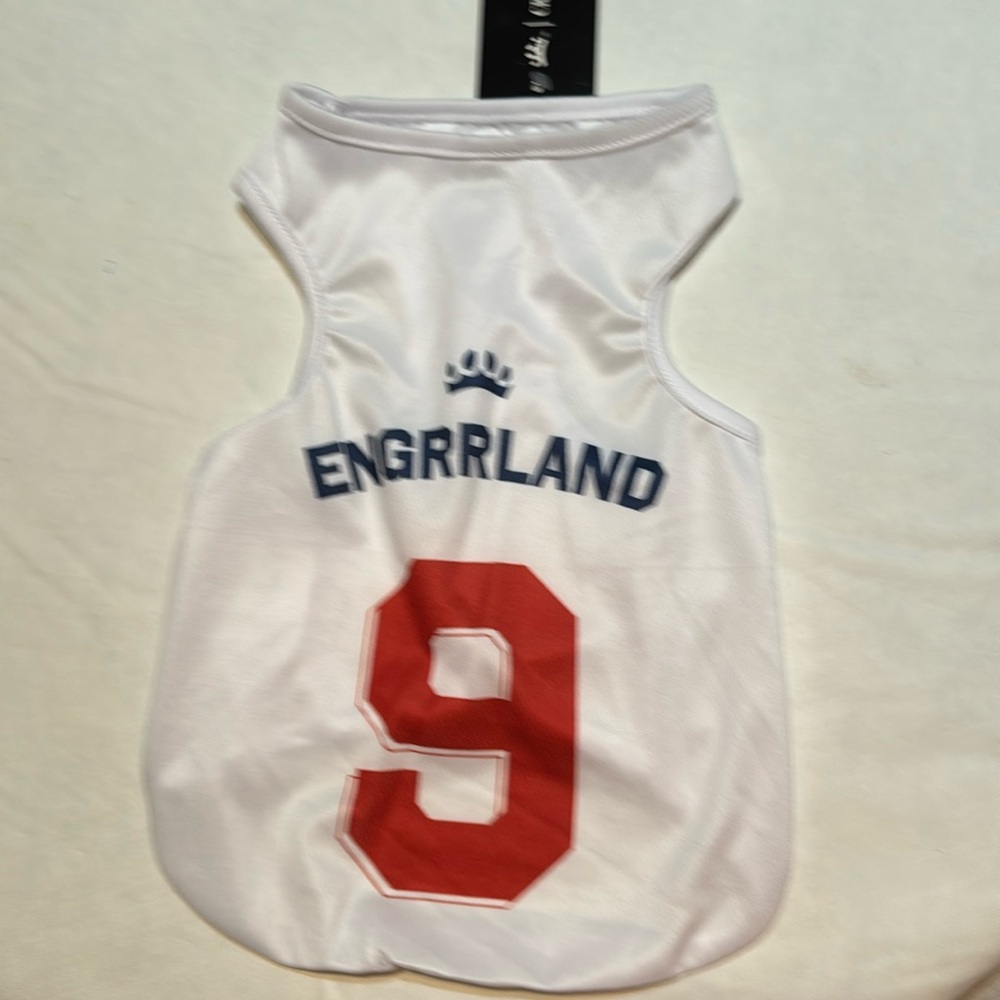 Dog, medium, blue, red letter number nine and white new jersey.